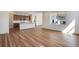 Open floor plan featuring a kitchen with an island and modern appliances at 24593 E 34Th Ave, Aurora, CO 80019