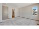 Large main bedroom with ensuite bathroom featuring a modern shower, tile and a door to the hallway at 24593 E 34Th Ave, Aurora, CO 80019