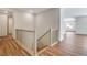 Staircase features wood steps and decorative painted railings at 24593 E 34Th Ave, Aurora, CO 80019