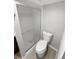 Bathroom with white toilet and a glass-enclosed shower at 7251 S Xenia Cir # B, Centennial, CO 80112