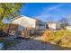 Home's backyard featuring a gravel area and a wooden fence at 1156 S Owens Ct, Denver, CO 80232