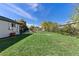 Large backyard area with a fire pit and seating, perfect for outdoor gatherings and leisure activities at 270 S Chase St, Lakewood, CO 80226