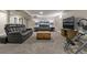 Finished basement with a gray carpet, two couches, and a wooden coffee table in the center at 270 S Chase St, Lakewood, CO 80226