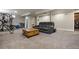 Finished basement featuring carpeted floors, a comfy seating area, and workout space at 270 S Chase St, Lakewood, CO 80226