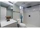 Bathroom featuring a walk in shower, toilet, and vanity with a white countertop at 270 S Chase St, Lakewood, CO 80226
