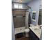 Full bathroom featuring a blue color scheme, wooden floors, and walk-in shower at 270 S Chase St, Lakewood, CO 80226