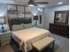 Bedroom featuring a queen size bed, dresser, and soft natural light at 270 S Chase St, Lakewood, CO 80226