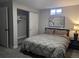 Cozy bedroom with gray walls, carpet, and a comfortable bed with decorative art on the wall at 270 S Chase St, Lakewood, CO 80226