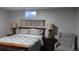 Bedroom featuring a bed with a wooden frame and two lamps on nightstands at 270 S Chase St, Lakewood, CO 80226