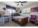 Bright bedroom with desk, bed, and windows providing natural light and views at 270 S Chase St, Lakewood, CO 80226