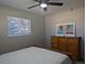 Comfortable bedroom with soft lighting, a dresser, and a calming atmosphere at 270 S Chase St, Lakewood, CO 80226