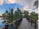 Wooden dock extending into a tranquil lake, offering peaceful views and relaxation at 270 S Chase St, Lakewood, CO 80226