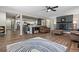 Open concept living room and kitchen features luxury vinyl flooring, ceiling fan and fireplace at 270 S Chase St, Lakewood, CO 80226