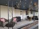 Inviting covered patio with string lights, comfortable seating, and outdoor dining area at 270 S Chase St, Lakewood, CO 80226