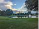 Scenic pond with a fountain, lush greenery, and a peaceful atmosphere, perfect for relaxation and enjoyment at 270 S Chase St, Lakewood, CO 80226