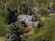 Sprawling brick home in wooded, mature neighborhood with plenty of trees and landscaping at 29 Viking Dr, Cherry Hills Village, CO 80113