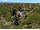 Stunning aerial view of a stately home nestled among mature trees and lush landscaping at 29 Viking Dr, Cherry Hills Village, CO 80113