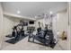 Finished basement features a dedicated home gym area with modern exercise equipment at 29 Viking Dr, Cherry Hills Village, CO 80113