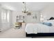 Inviting bedroom with built-in desk area and a large window for ample natural light at 29 Viking Dr, Cherry Hills Village, CO 80113