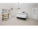 Spacious bedroom with built-in desk area, decorative chandelier, and white color scheme at 29 Viking Dr, Cherry Hills Village, CO 80113