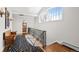 Sunlit upper hall with decorative rug and banister leads to a well-appointed bathroom at 29 Viking Dr, Cherry Hills Village, CO 80113