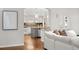 Open-concept design showcases a stylish kitchen with an island, pendant lighting, and stainless steel appliances at 29 Viking Dr, Cherry Hills Village, CO 80113