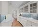 Bright, white kitchen with granite countertops, stainless steel appliances, and hardwood floors at 29 Viking Dr, Cherry Hills Village, CO 80113