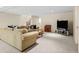 Expansive living room features a comfortable sofa and media setup at 29 Viking Dr, Cherry Hills Village, CO 80113