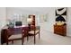 Bright office features plantation shutters, neutral walls, and stylish desk and chair set at 29 Viking Dr, Cherry Hills Village, CO 80113