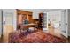 Spacious office featuring custom wood built-ins and large windows, perfect for working from home at 29 Viking Dr, Cherry Hills Village, CO 80113