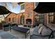 Enjoy outdoor living with a stone patio, fireplace and ample seating at 29 Viking Dr, Cherry Hills Village, CO 80113