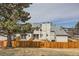 Fenced backyard featuring a neatly kept lawn and privacy, perfect for relaxing and entertaining at 8898 W Plymouth Ave, Littleton, CO 80128