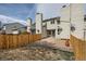 Private fenced backyard offering a serene outdoor space with minimal grass and patio stones at 8898 W Plymouth Ave, Littleton, CO 80128