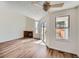 Inviting living room featuring wood floors, a brick fireplace, and sliding glass doors for natural light at 8898 W Plymouth Ave, Littleton, CO 80128