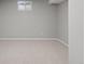Open basement area with carpet and natural light at 2408 E Cresthill Ave, Centennial, CO 80121