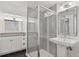 Modern bathroom features hexagon floors, glass shower, and pedestal sink at 2408 E Cresthill Ave, Centennial, CO 80121