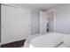 Bedroom features hardwood floors, closet, and simple design elements for a calming aesthetic at 2408 E Cresthill Ave, Centennial, CO 80121