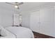 Cozy bedroom featuring a ceiling fan, neutral walls, and a spacious closet at 2408 E Cresthill Ave, Centennial, CO 80121