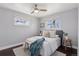 Bright bedroom with modern decor, hardwood floors, and natural light from two windows at 2408 E Cresthill Ave, Centennial, CO 80121