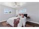 Bright bedroom featuring hardwood floors, neutral walls, and a ceiling fan at 2408 E Cresthill Ave, Centennial, CO 80121