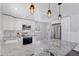 Modern kitchen design with granite countertops, stainless steel appliances, and white subway tile backsplash at 2408 E Cresthill Ave, Centennial, CO 80121