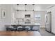 Bright and airy kitchen features granite countertops, stainless steel appliances, and modern pendant lighting at 2408 E Cresthill Ave, Centennial, CO 80121