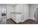 Finished laundry room with sink, cabinets and folding area at 2408 E Cresthill Ave, Centennial, CO 80121