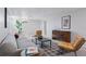 Inviting living room with a gray couch, plants, and a modern coffee table at 2408 E Cresthill Ave, Centennial, CO 80121