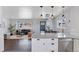 Open concept living room area featuring hardwood floors, a large couch and plenty of natural light at 2408 E Cresthill Ave, Centennial, CO 80121