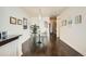 Bright dining room boasts sleek hardwood floors, modern lighting, and stylish furnishings for a contemporary living experience at 891 14Th St # 2205, Denver, CO 80202