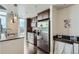 Modern kitchen features stainless steel appliances and dark wood cabinetry at 891 14Th St # 2205, Denver, CO 80202