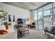 Bright living room with floor-to-ceiling windows showcasing city views at 891 14Th St # 2205, Denver, CO 80202