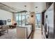 Living space with city views, a sleek kitchen, and modern furnishings at 891 14Th St # 2205, Denver, CO 80202