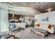 Open-concept living area with a sleek kitchen and comfortable seating at 891 14Th St # 2205, Denver, CO 80202